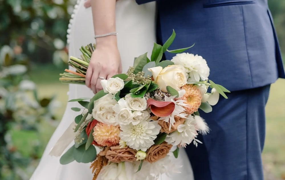 Focus on flowers while a couple gets married at one of the best Durham wedding venues in North Carolina