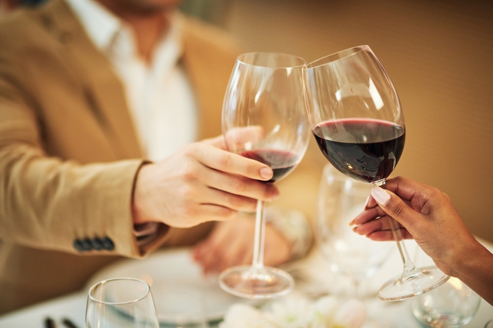 Couple enjoying wine while at one of the most romantic restaurants in Durham, NC