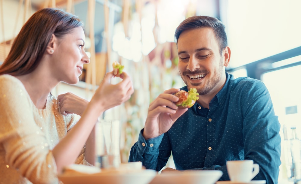The Best Places to Eat in Durham, NC 4 Enjoy the best places to eat in Durham, NC. Couple laughing and eating their food.